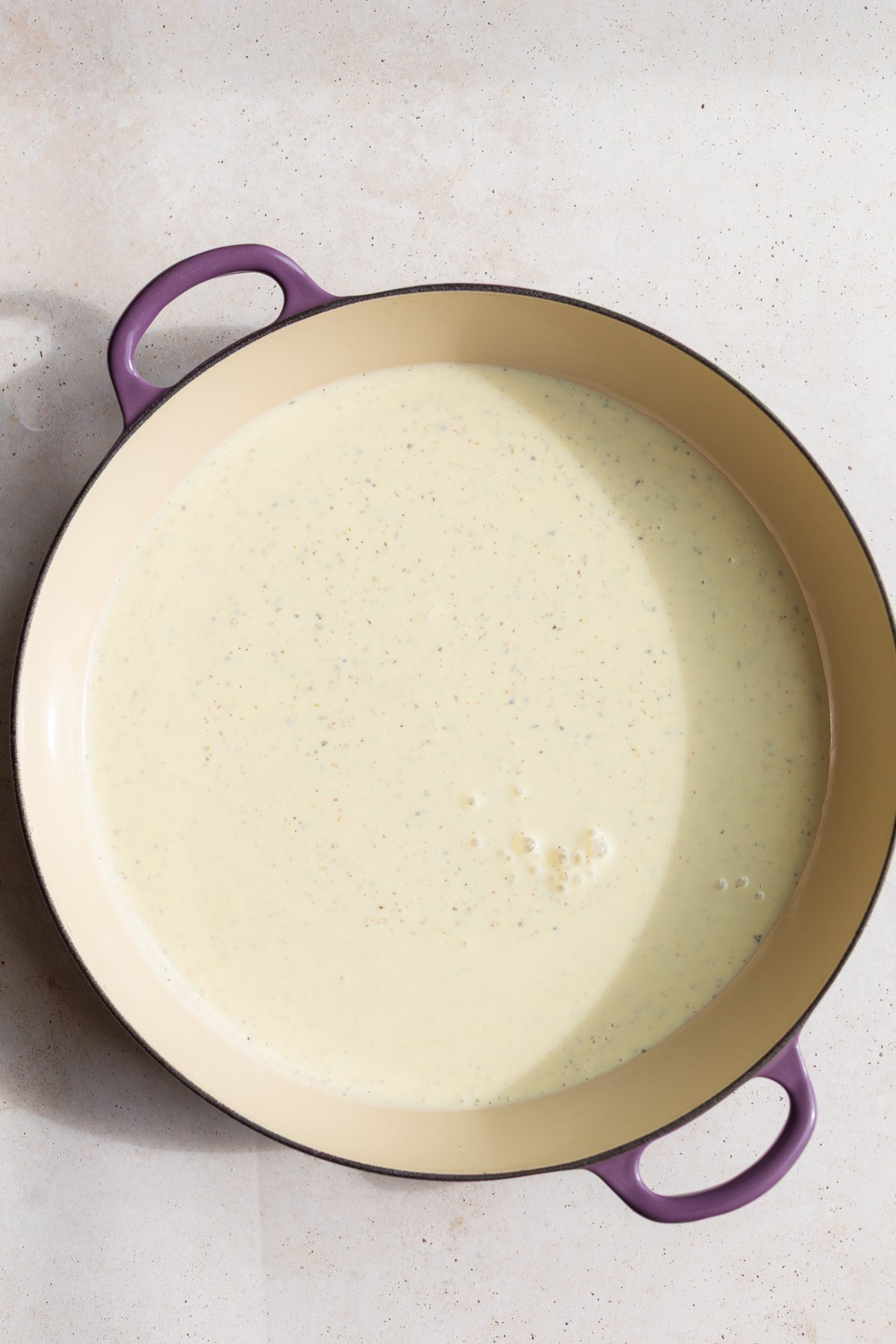 Cooking tofu pasta sauce in a large pot.
