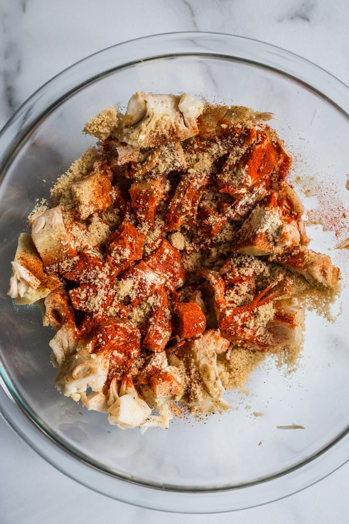 large bowl of jackfruit pieces with spices on top including paprika