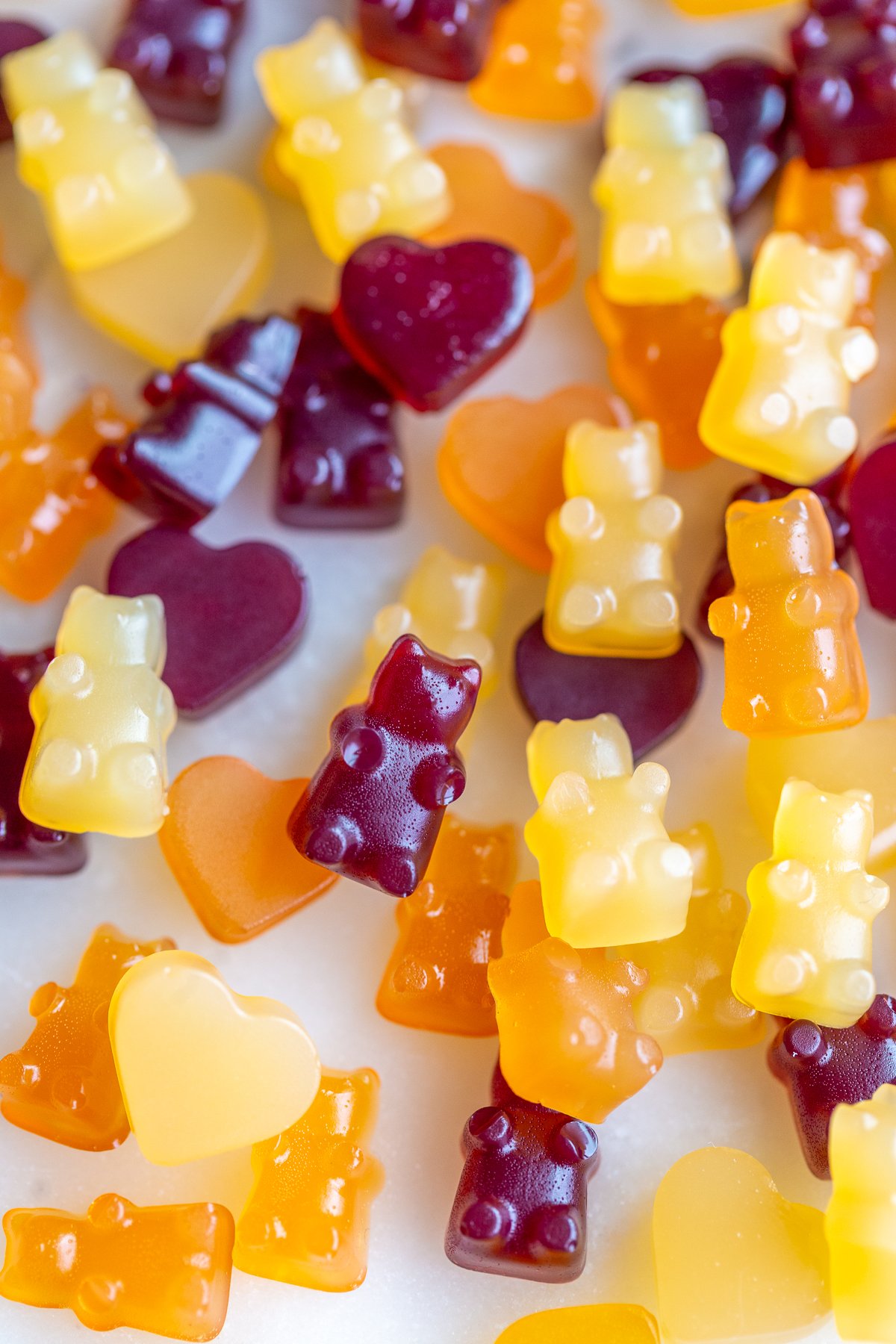 Vegan gummy bears that are yellow, orange and red.